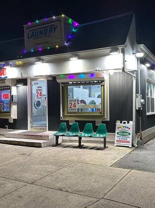 Night shot—uplit black composite cladding on laundry wall