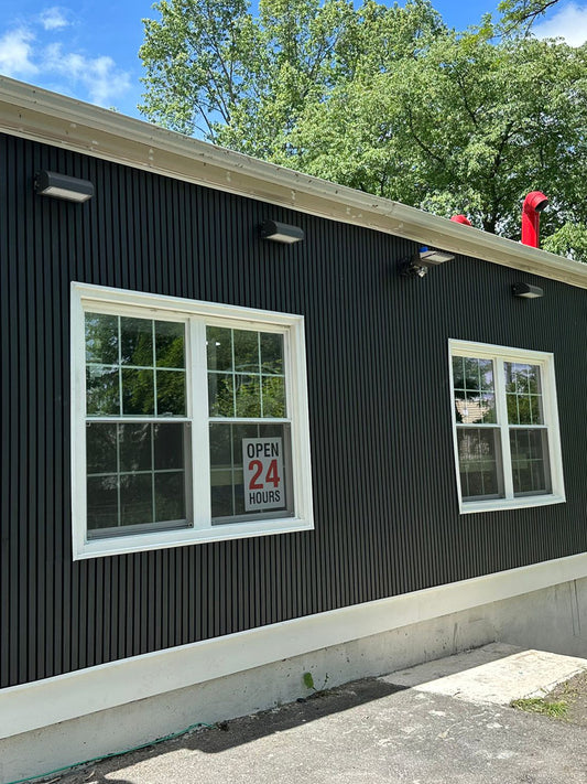 Black composite cladding boards on an exterior wall