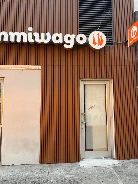 Brown composite cladding boards on modern front elevation with large windows