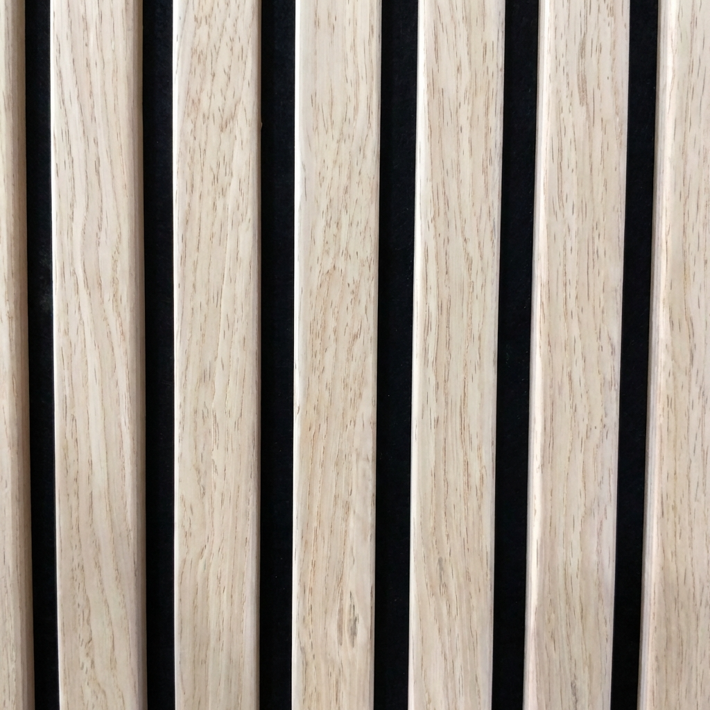 Close-up of oak acoustic slat wall panel with black felt backing
