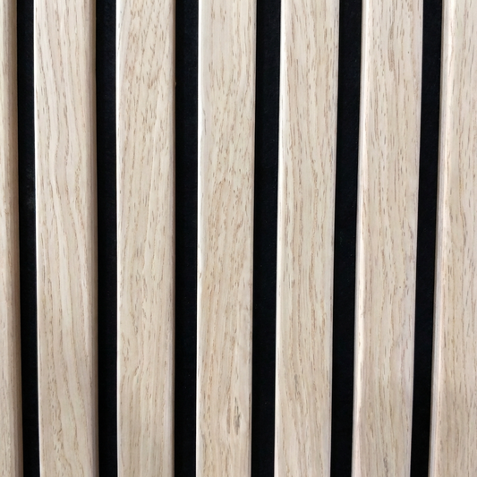 Close-up of oak acoustic slat wall panel with black felt backing
