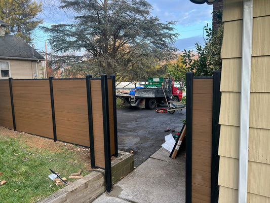 Side yard composite privacy fence with matching single gate