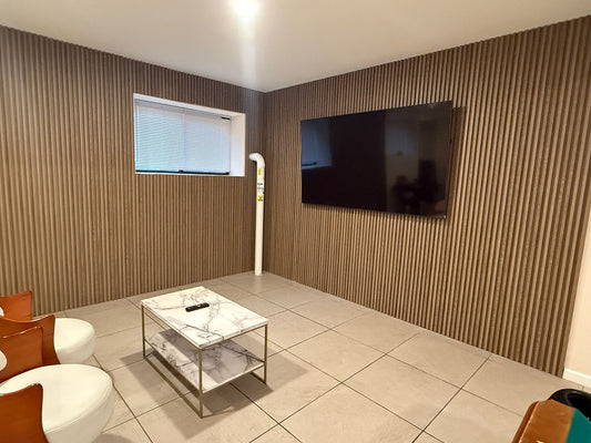 Walnut acoustic wall panels for warm modern living room