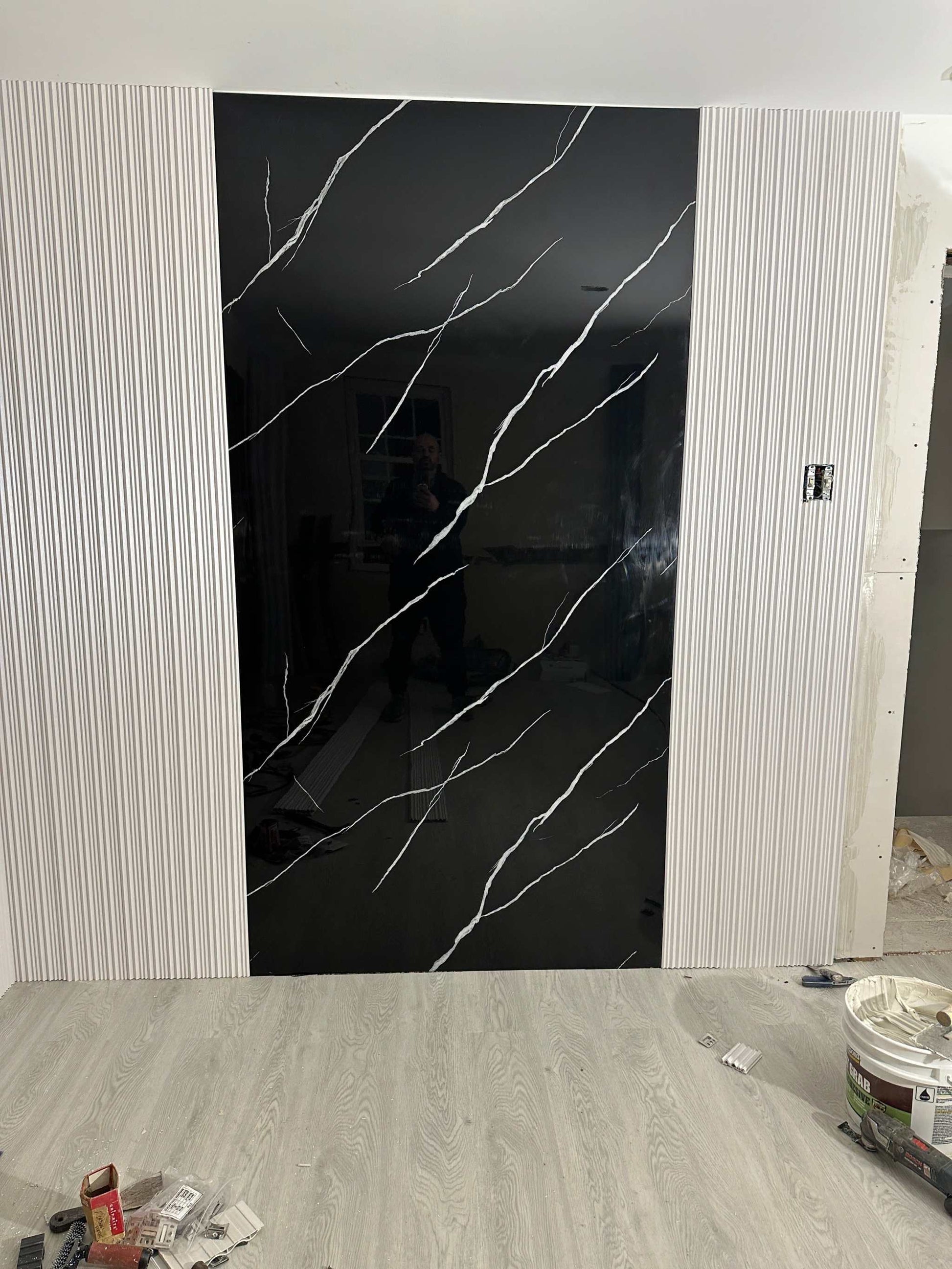 Deep black marble PVC wall panel with white veins, 4x8 ft, fireproof & waterproof, ideal for NJ homes & offices.