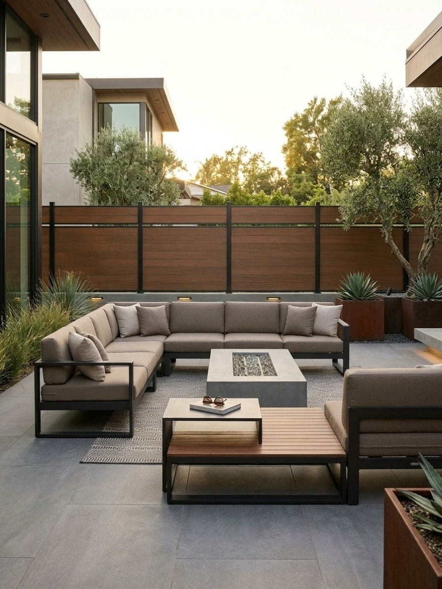 Walnut single-divider composite privacy fence surrounding a modern outdoor seating area