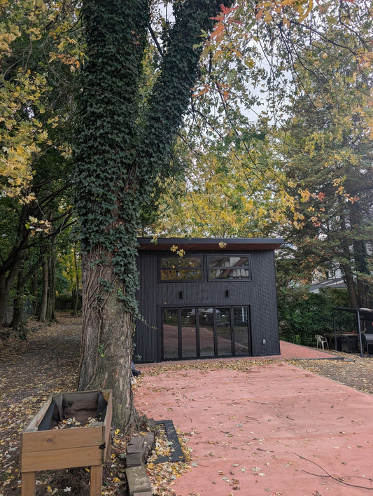 Black composite wide exterior cladding on modern house