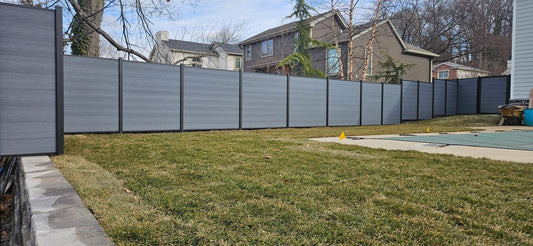 Light grey composite fencing for residential outdoor use