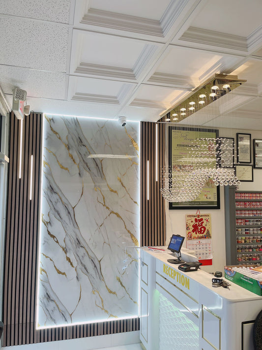 Stylish barber shop interior with glossy PVC marble walls